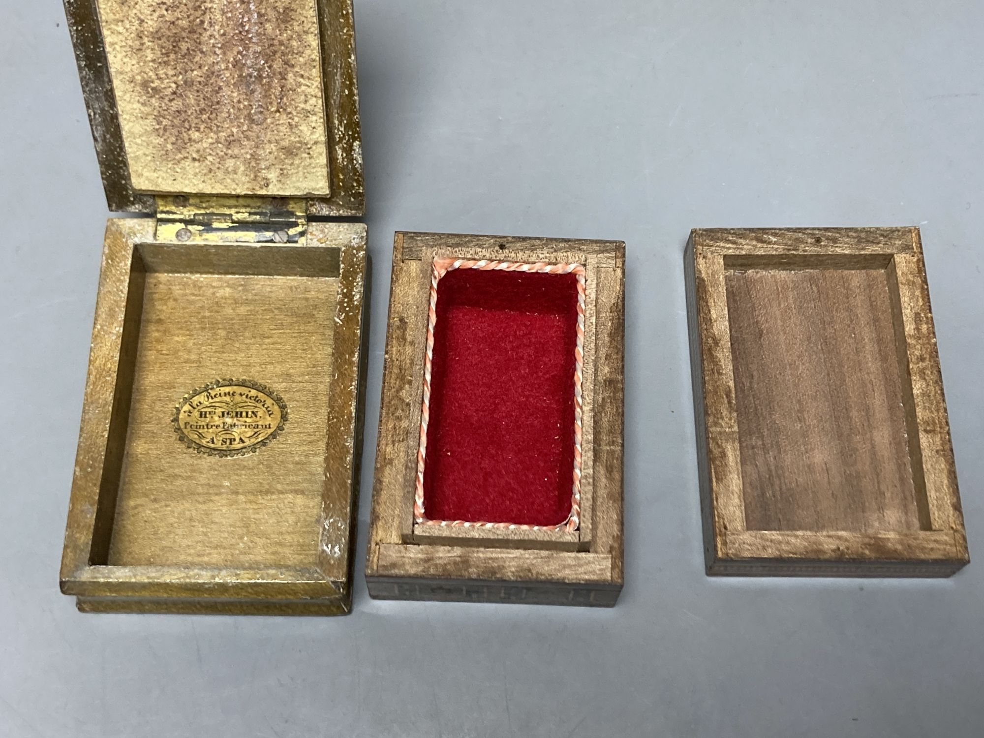 A Tunbridge ware tesserae mosaic photo frame, 15.3cm high, a Belgian Spa flower painted matchbox, a boxwood 'beehive' string box and a marquetry box